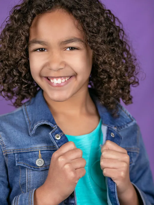 Headshot of a young performer represented by Level Talent Group