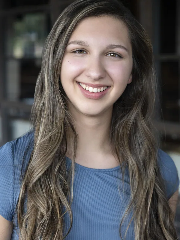 Headshot of a young performer represented by Level Talent Group