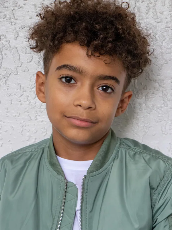 Headshot of a young performer represented by Level Talent Group