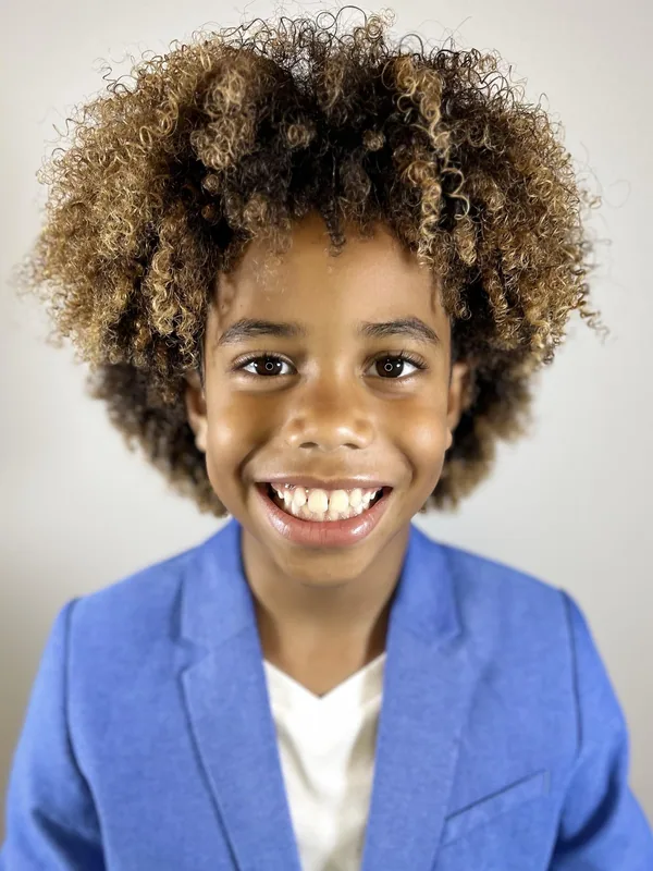 Headshot of a young performer represented by Level Talent Group