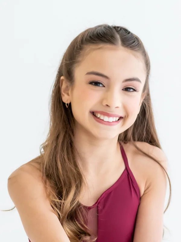 Headshot of a young performer represented by Level Talent Group